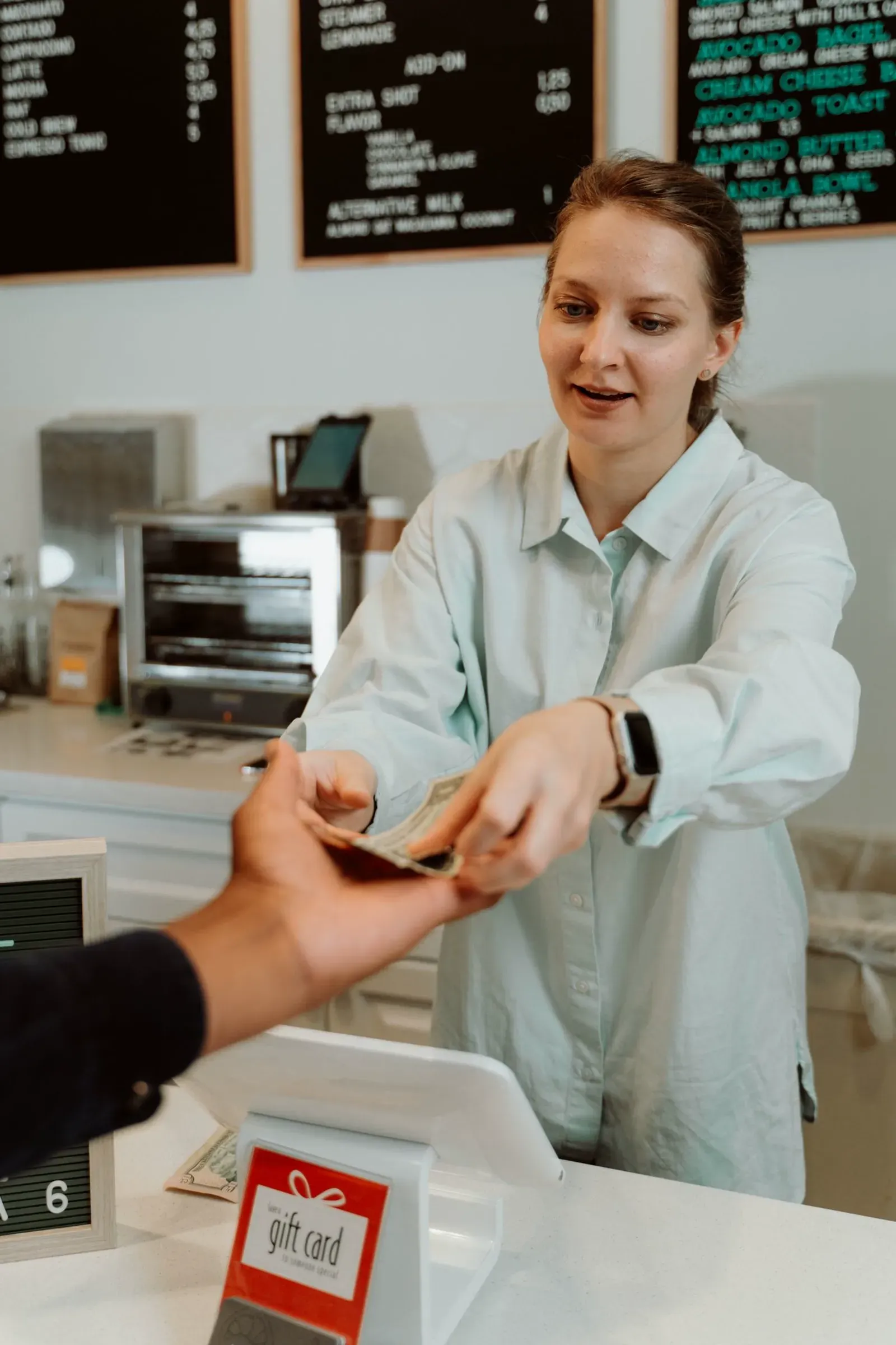 Customer paying at a shop counter cash register Fisher Scales Norfolk
