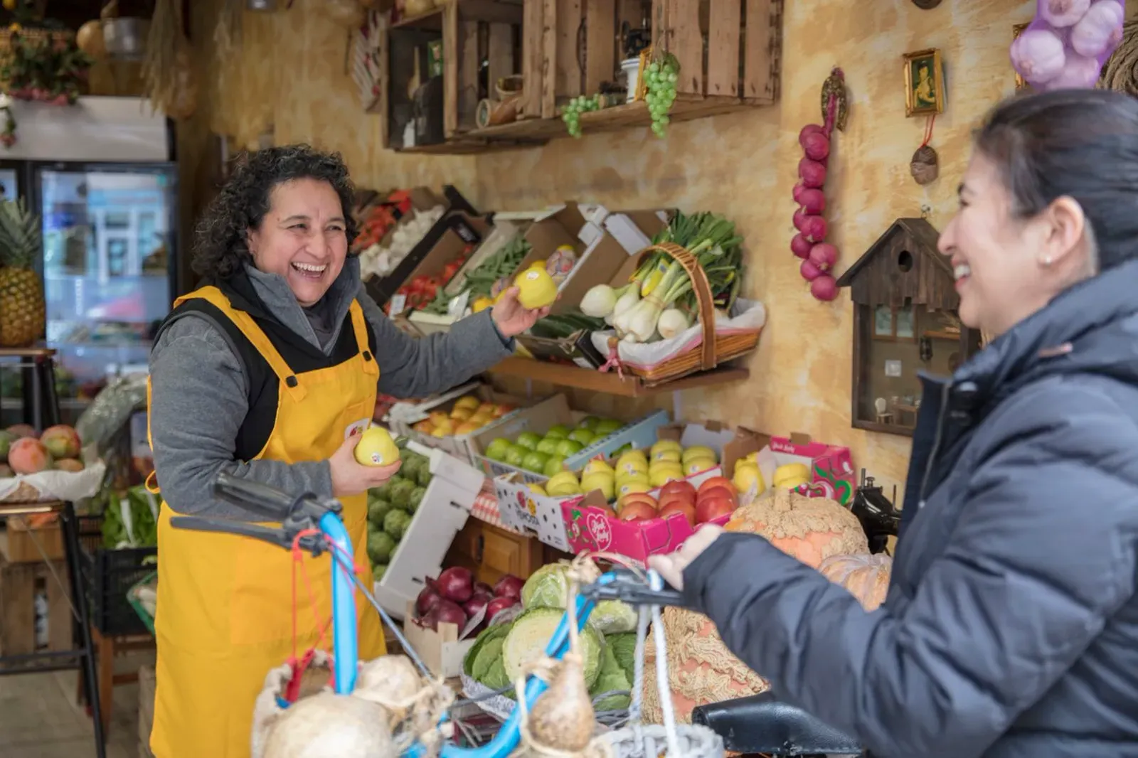 Greengrocer serving a customer at a shop counter Fisher Scales Norfolk